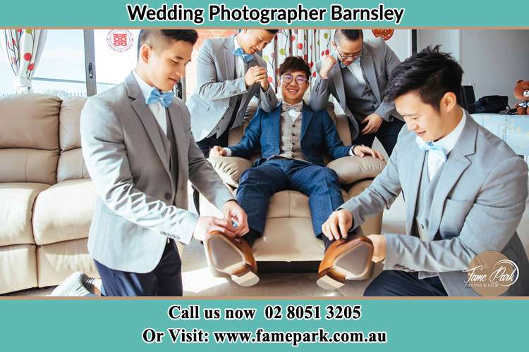 The Groom is being prepared for the wedding by his groomsmen Barnsley