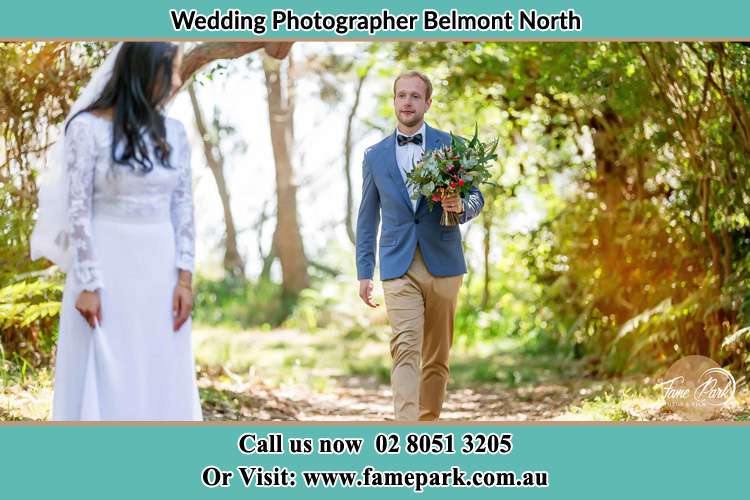 Photo of the Groom bringing flower to the Bride Belmont North NSW 2280