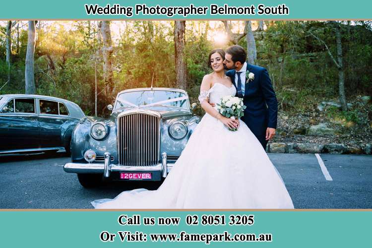 Photo of the Bride and Groom besides the bridal car Belmont South