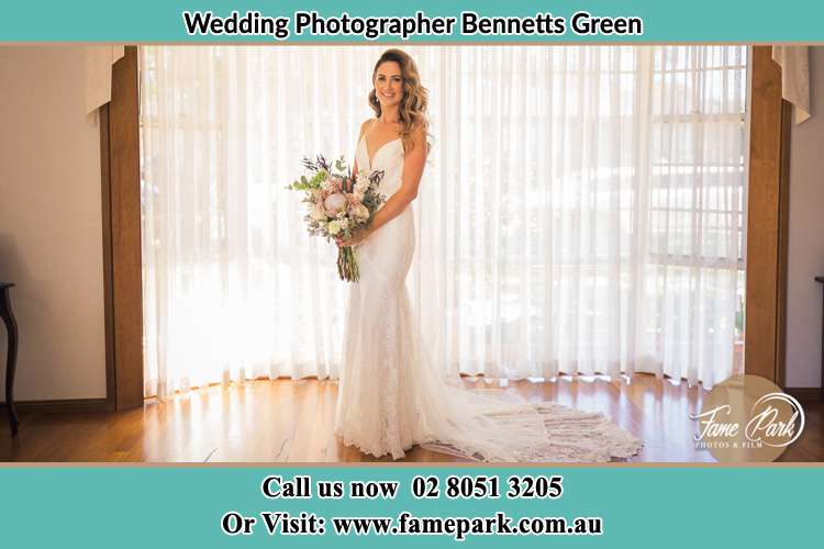 Photo of the Bride holding flower bouquet Bennetts Green NSW 2290