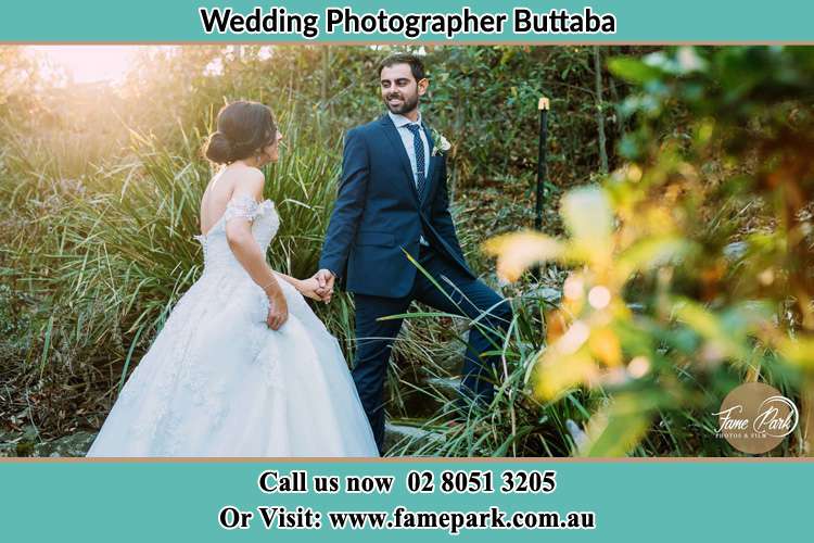 Photo of the Bride and the Groom going up the hill Buttaba NSW 2283