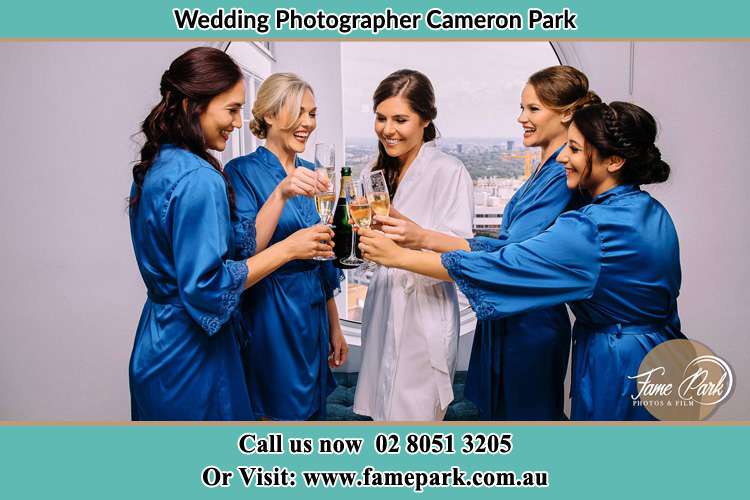 Photo of the Bride and the bridesmaids having wine Cameron Park NSW 2285