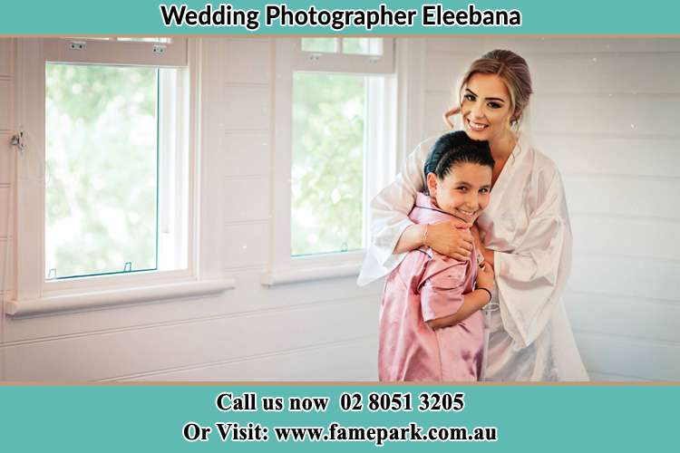 Photo of the Bride hugging the flower girl Eleebana NSW 2282