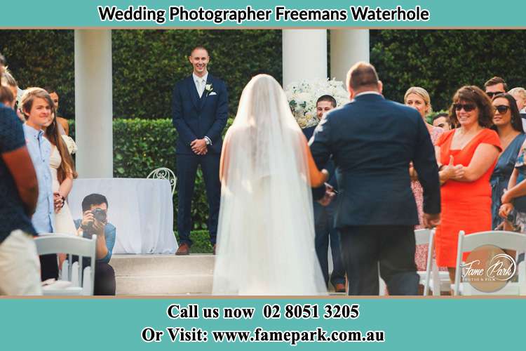 Photo of the Bride with her father walking the aisle Freemans Waterhole NSW 2323