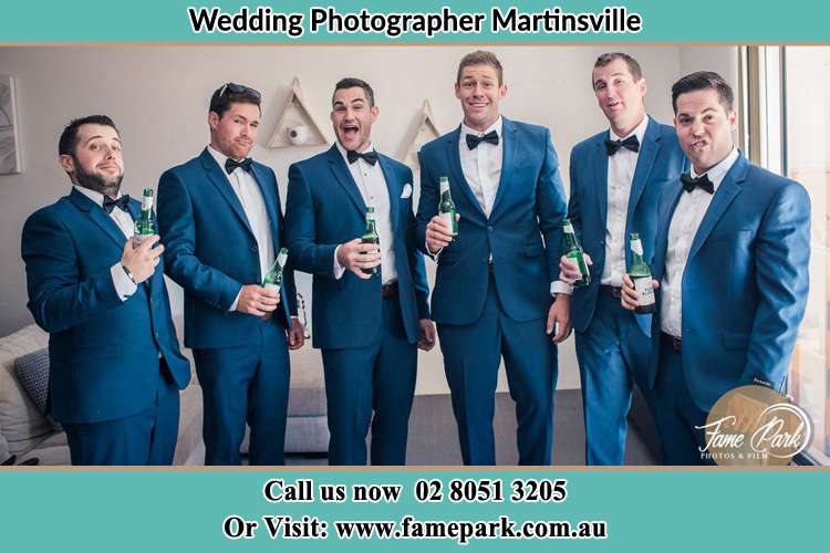 The groom and his groomsmen striking a wacky pose in front of the camera Martinsville NSW 2265