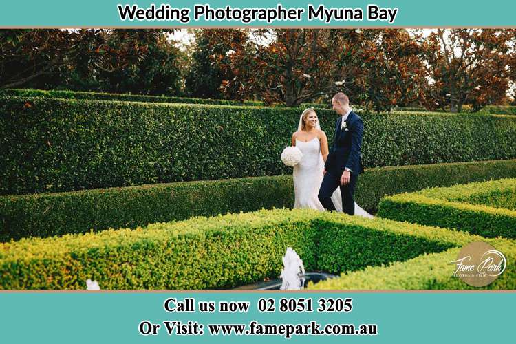 Bride and Groom walking at the garden Myuna Bay