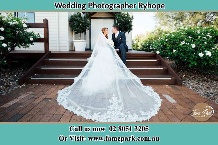 Bride and Groom sit on the staircase Ryhope