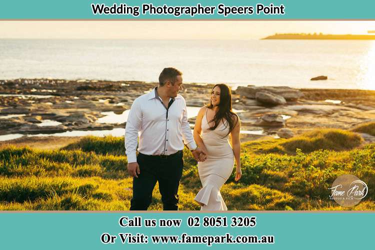 Photo of the Groom and the Bride walking near the lake Speers Point NSW 2284