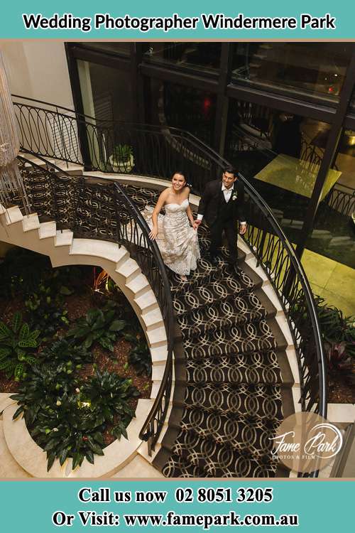 Bride and Groom walking down the stairs Windermere Park